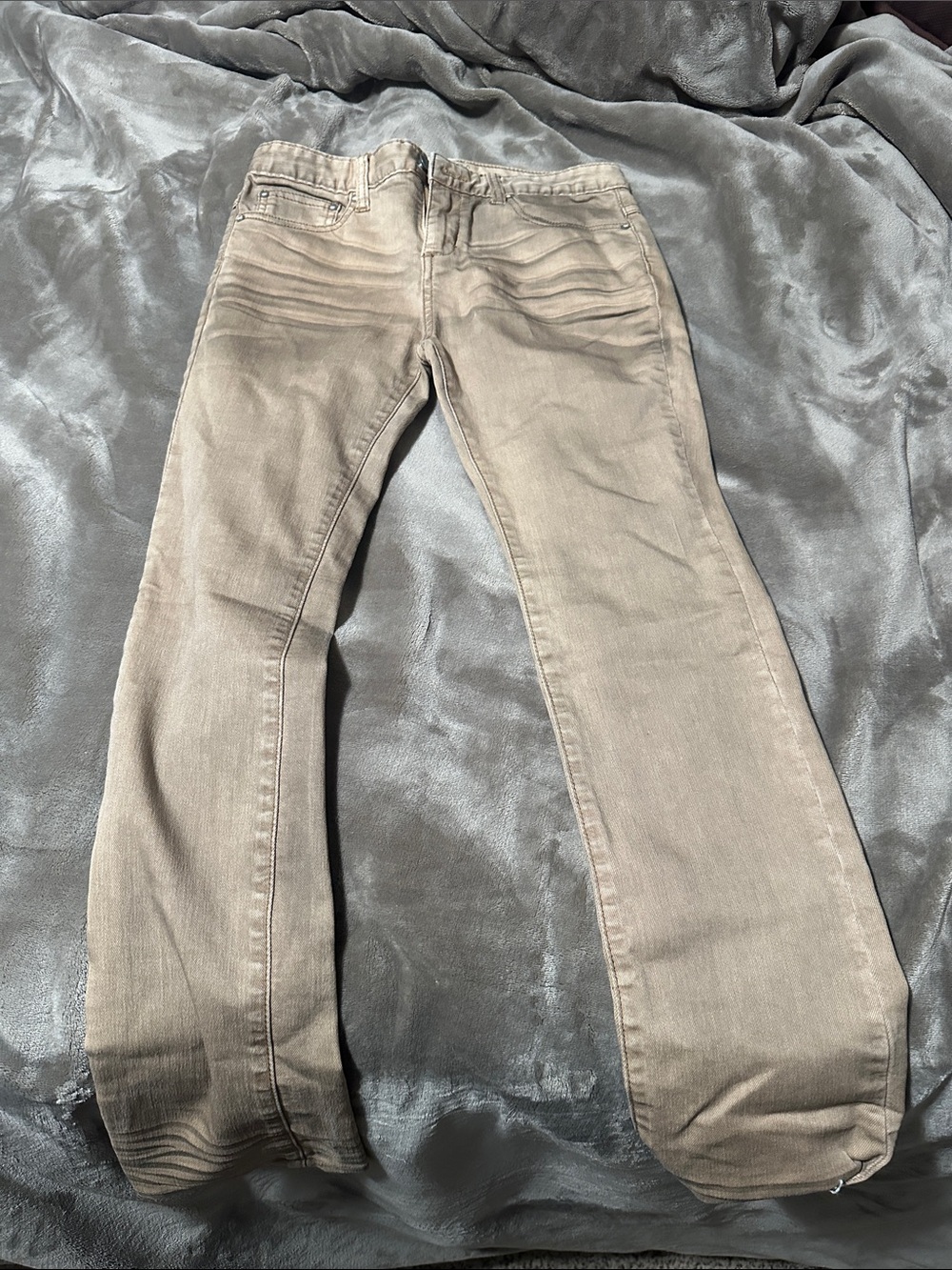 Free People tan and grey skinny jeans.